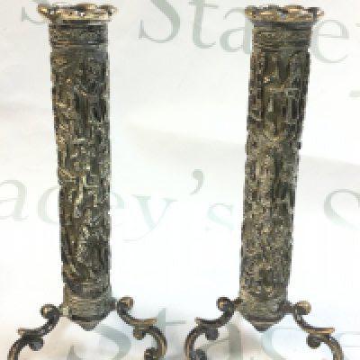A pair of late 19th century white metal candlesticks , possibly Tibetan. Postage category B