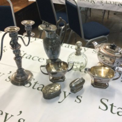 Silver plated items including a candelabra, sauce boat, table lighter, claret jug etc . Postage category B NO RESERVE
