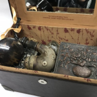 a vintage case designed for L Oreal Paris containing small tins with contents, small trinket boxes, pill boxes etc . Postage category B