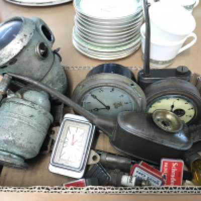 A box containing three vintage car clocks and other items . This lot cannot be posted
