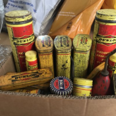 A box containing vintage Dunlop and other tins. Postage category B
