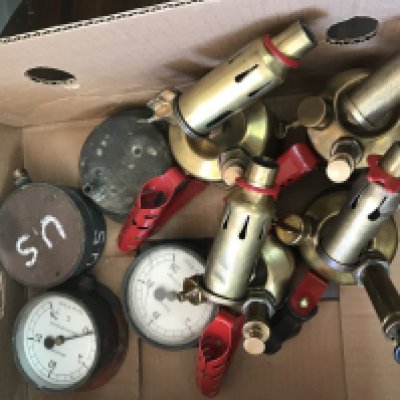 A box containing burners and gauges.