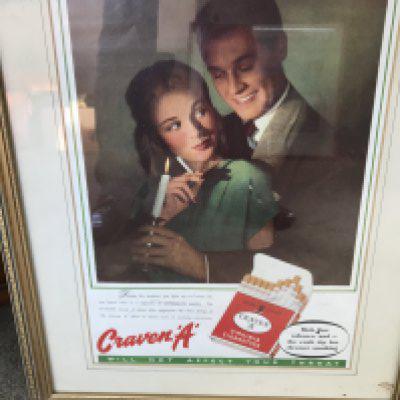 Four framed advertisement pictures.