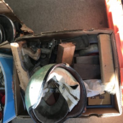 Five boxes containing moulding planes small oil tanks and car parts various and a vintage motorcycle helmet.