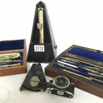 A Swiss made Metronome two cased sets of vintage architects drawing instruments and a Vintage miniature ELJY Lumiere camera (4)
