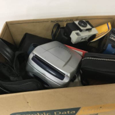 A box containing cameras and other oddments.