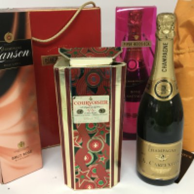 A collection of Champagne Piper Heidsiek Lanson and others. A bottle of Courvoisier VS Cognac.