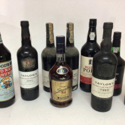 A collection of Ports two bottles of Taylor&#2013266057۪s 1978 one 1999 one 2011and other bottles Port Rum Brandy.
