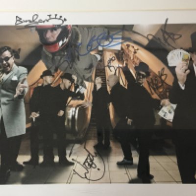 A signed Madness group photograph signed in Birmingham 2010 with certificate of Authenticity.