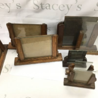 A collection of assorted size art deco style wooden frames.