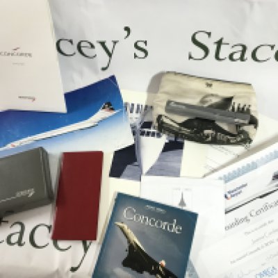 A box containing Concorde memorabilia including playing cards, note pad, pocket book, boarding certificate etc. postage category B