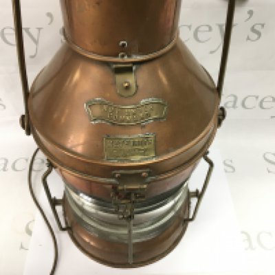 A copper and brass ship lamp which has been wired at a later date. 66cm tall. Postage D