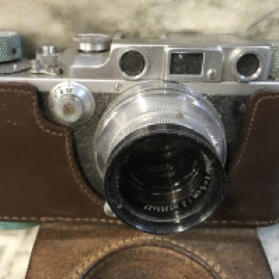 A Leica camera D.R .P No 282657 Summar lens 1.2 No 350427 .fitted in a leather case .