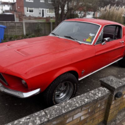 1968 Ford Mustang Fastback, V8 390 CID 4V Big Block, LHD, In need of some restoration, signs of impact and repair on rear quarter. Remnants of a Nitros setup in boot space. Repainted from its original Royal Maroon colour to the current registered Red. Currently on to extra wide BF Goodrich tyres on rear, 2 additional wheels present, Interior has maroon leather upholstery. Full V5 present. Previously driven and shown at car meets across the country over 7 years ago. Mileage 79,500Please note this car is not on site at our websters way address, we have a dedicated viewing day on Saturday 12th April between 10am - 2pm via appointment, please contact the office for additional address information.