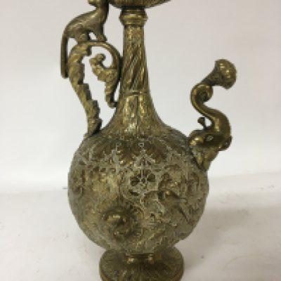 A Quality and interesting 19th century wine vessel with profuse decoration with birds and foliage raised heads a scroll handle and elephant shaped spout. Height 26cm.