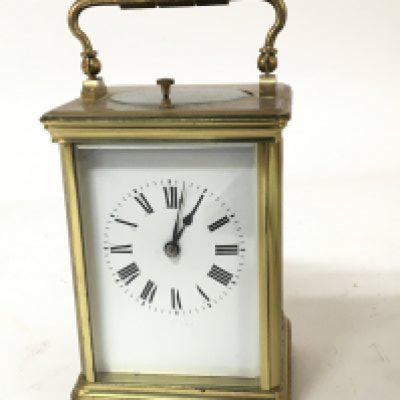 A French brass cased strike repeat carriage clock with a white enamel dial Hight 13cm