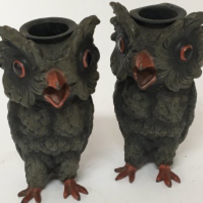 A pair of Novelty painted metal candle sticks in the form of owls. Hight 13cm.