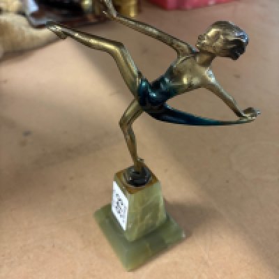 An 8" bronze on stone base figure attributed to Lorenzl. Chip to base and wear to dress.