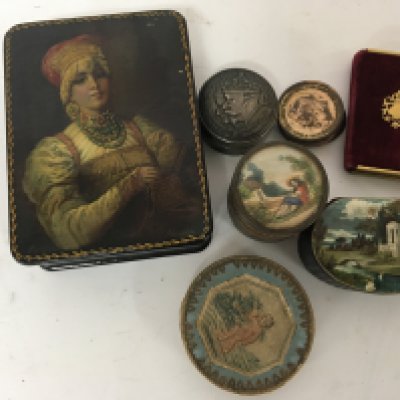 A collection of objects of Vertu A Russian hand painted box small silver box of circular shape trench art coin cap a miniature velvet covered book.