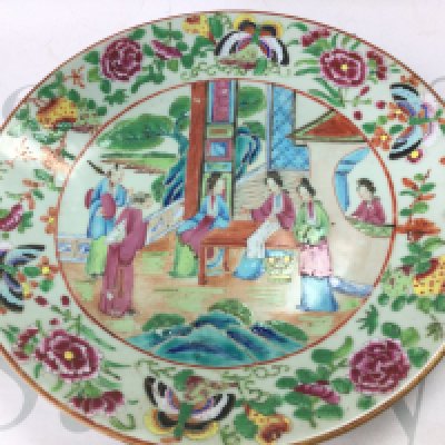 A Chinese Cantonese Famille Rose dish 26cm wide . Hairline crack on the underside of the dish.