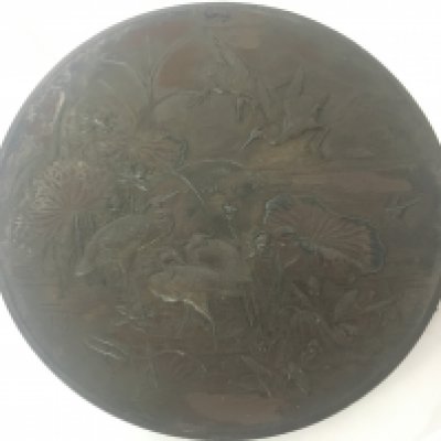A Quality Japanese 19th century bronzed metal plaque with raised stalks and lily pads signed with a seal mark diameter 46cm