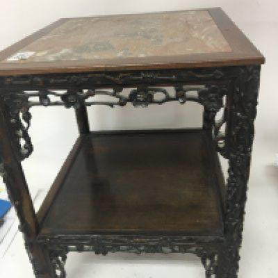 A Chinese late 19th century carved hardwood two tier stand inset with a marble top the tier edges with open naturalistic floral carving. Small piece of moulding missing see image Hight 47cm