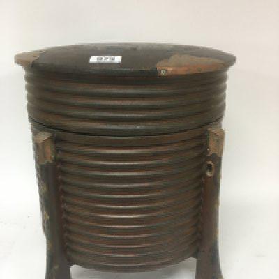 A large Oriental lacquer vessel of circular shape with ornate copper mounts. Height 43cm