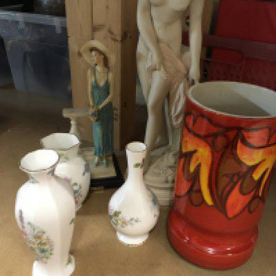 A collection of ceramics including Poole and Aynsley together with art Deco style figures.