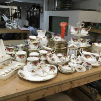 A large collection of Royal Albert Old English Country Roses tea and dinner service set- including heart posy vase, lidded trinket box, candlestick holder, gravy boat, photo frame etc- some with possible second quality. NO RESERVE