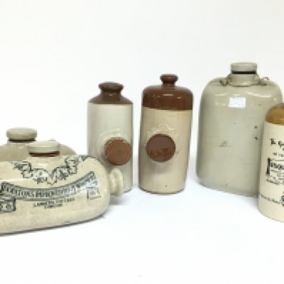 A Collection of stoneware bottles including a Usquaebach Scottish whisky bottle, Doulton Improved foot warmer etc