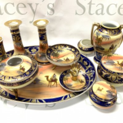 A Noritake porcelain dressing table set with camel and desert scene. (D)