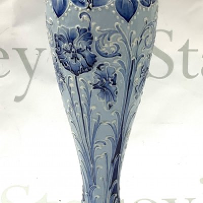A Macintyre Florian Ware vase. 30cm (D) Slight restoration to rim.
