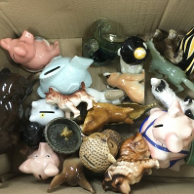 A box of assorted ceramic and glass items including money boxes and a beswick horse. Postage D