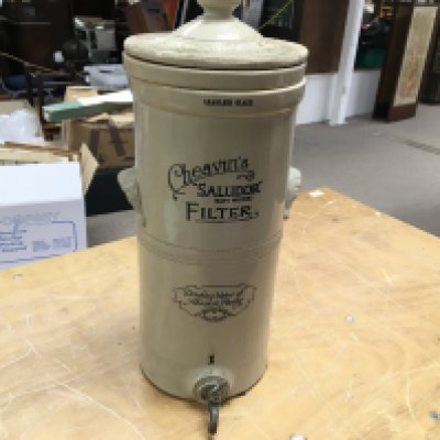 A 19th century cheavins saludor stoneware water filter. Approximately 50cm tall.