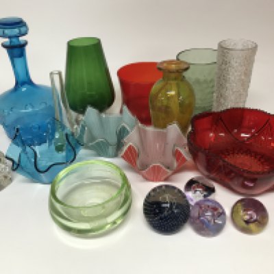 A mixed collection of cut and coloured glassware including paperweights.