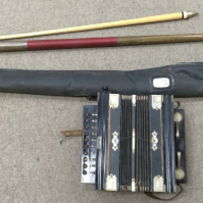 A Keith Prowse accordion and a pool cue. Postage category C