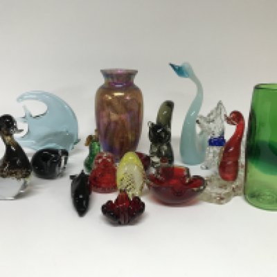 A collection of cut glass and paperweights, some animal examples.