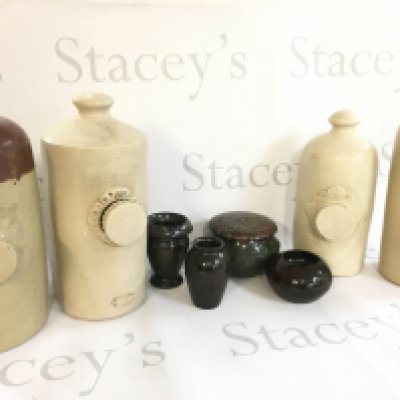 A Collection of Cornish art glass serpentine vases and stoneware bottles. This lot cannot be posted