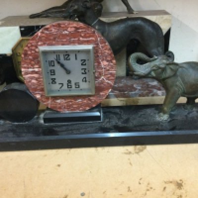 Three Art Deco mantle clocks surmounted with figures, dog and elephant.0