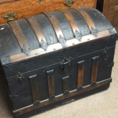 A quality Victorian dome top travelling trunk with wood and metal bound over leather. NO RESERVE