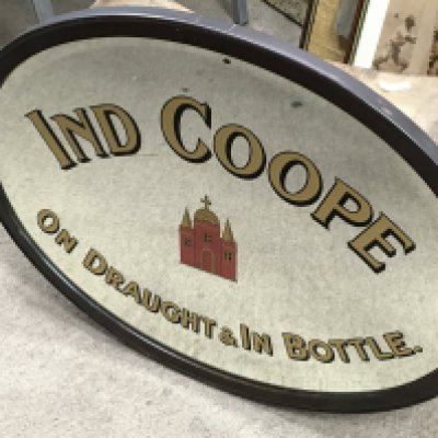 A vintage oval Ind Coppe On Draught & In bottle bar wall mirror, 63cm wide. This lot cannot be posted