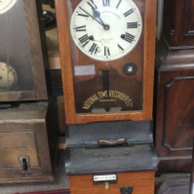 A National Time Record staff clock timing system in good condition with a metal mounted wood case St Mary Cray on the dial.