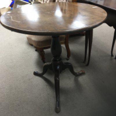 A George III Mahogany occasional table with a circular hinged top on a turned column top diameter 75cm wide.