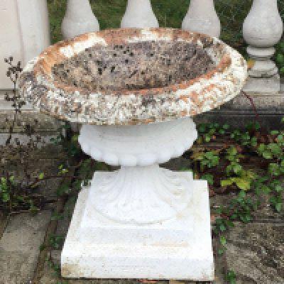 a set of four composition, concrete, neoclassical garden, earns in good condition freestanding. Height 60cm sold in situ buyer to collect.