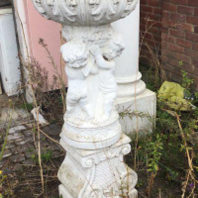 a pair of composition, concrete garden, earns of neoclassical style tops with stylised acanthus leaves above pussy on a shaped. Pedestal good condition sold in situ buyer to collect Height 125cm