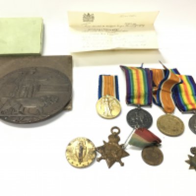 A death plaque awarded to Robert Watson and a collection of medals. Postage B