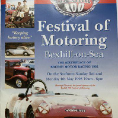 A Festival of Motoring Bexhill 100 brochure with an image signed by Sir Stirling moos on the inside cover. NO RESERVE