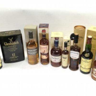 A Collection of whiskeys including Glenlivet, Auchentoshan, Strathisla, Edradour, Bowmore, Chivas Regal. This lot cannot be posted