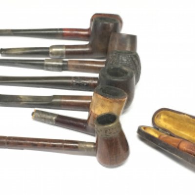 A Collection of pipes including a cased cheroot including some with silver hallmarked parts. Postage category B