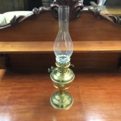 A brass oil lamp. 53cm tall. Postage D. NO RESERVE